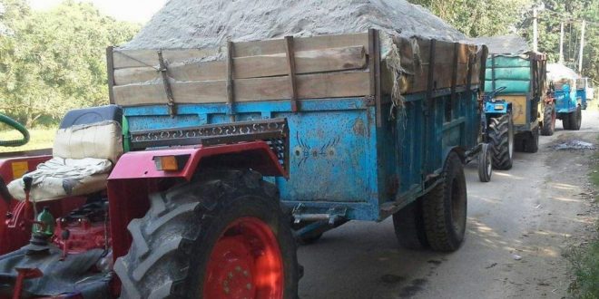 action overloaded tractor trolley