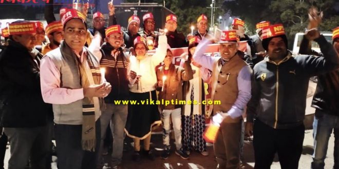 Employees protest burning candles