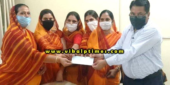 Mahila Mandal handed over cheque cooperation amount coron relief fund