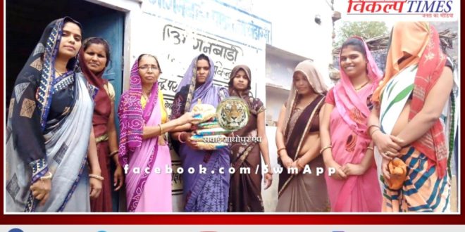 Distribution of food items in Anganwadi center khandar