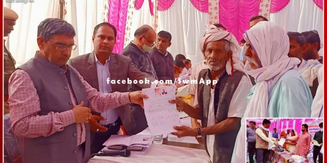 The happiness seen on the faces of the villagers after getting the lease and other certificates
