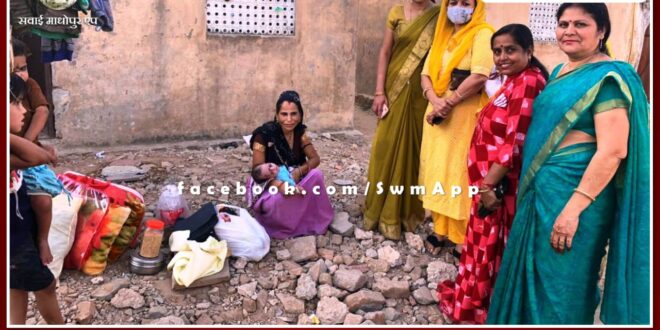 Relief material given to poor woman in sawai madhopur