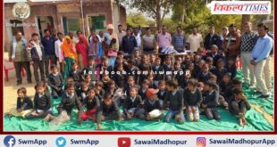 jerseys distributed to school children to protect them from cold in sawai madhopur