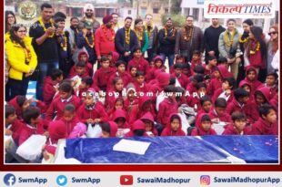 Distributed shoes, socks and warm clothes to the students in sawai madhopur