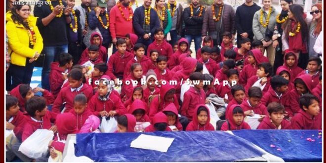 Distributed shoes, socks and warm clothes to the students in sawai madhopur