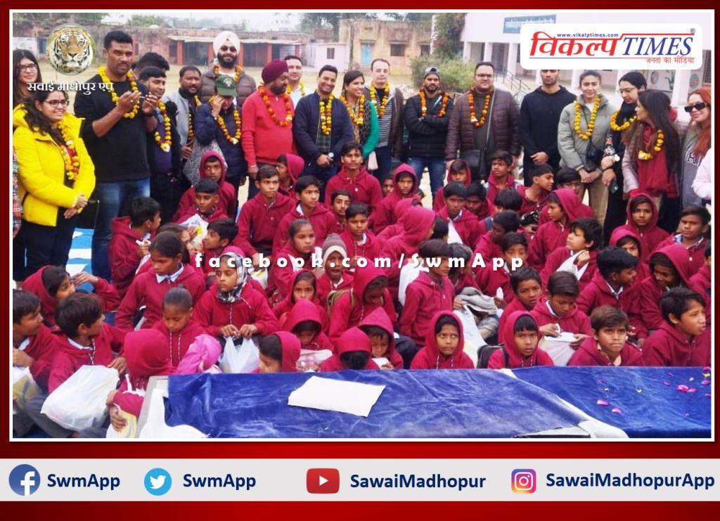 Distributed shoes, socks and warm clothes to the students in sawai madhopur