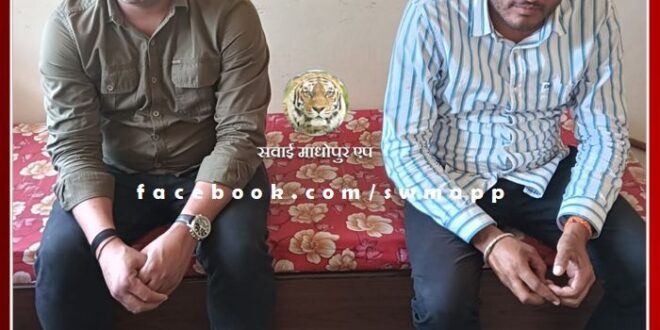 Batoda police officer and broker caught red handed taking bribe
