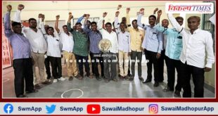 Cooperative society workers protested by tying black bands in bamanwas