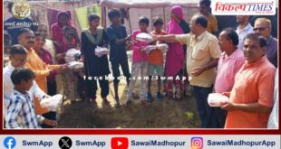 Lakshmi puja materials and sweets distributed to people living in slums in sawai madhopur