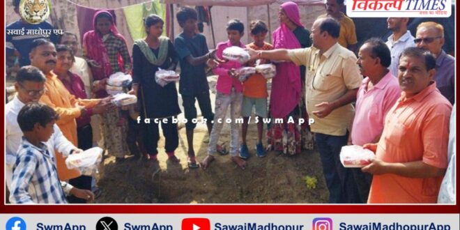 Lakshmi puja materials and sweets distributed to people living in slums in sawai madhopur