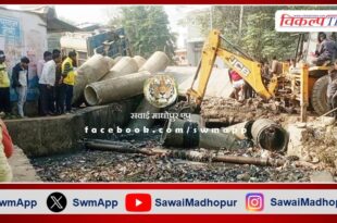 Truck filled with pipes overturned in drain due to culvert collapse
