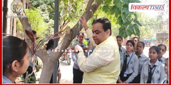 Chief Government Secretary of Technical Education Department tied water pot for birds.