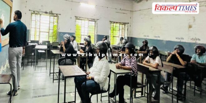 Students sitting in the classroom wearing helmets in kota