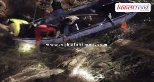 A tractor-trolley loaded with straw overturned in kota